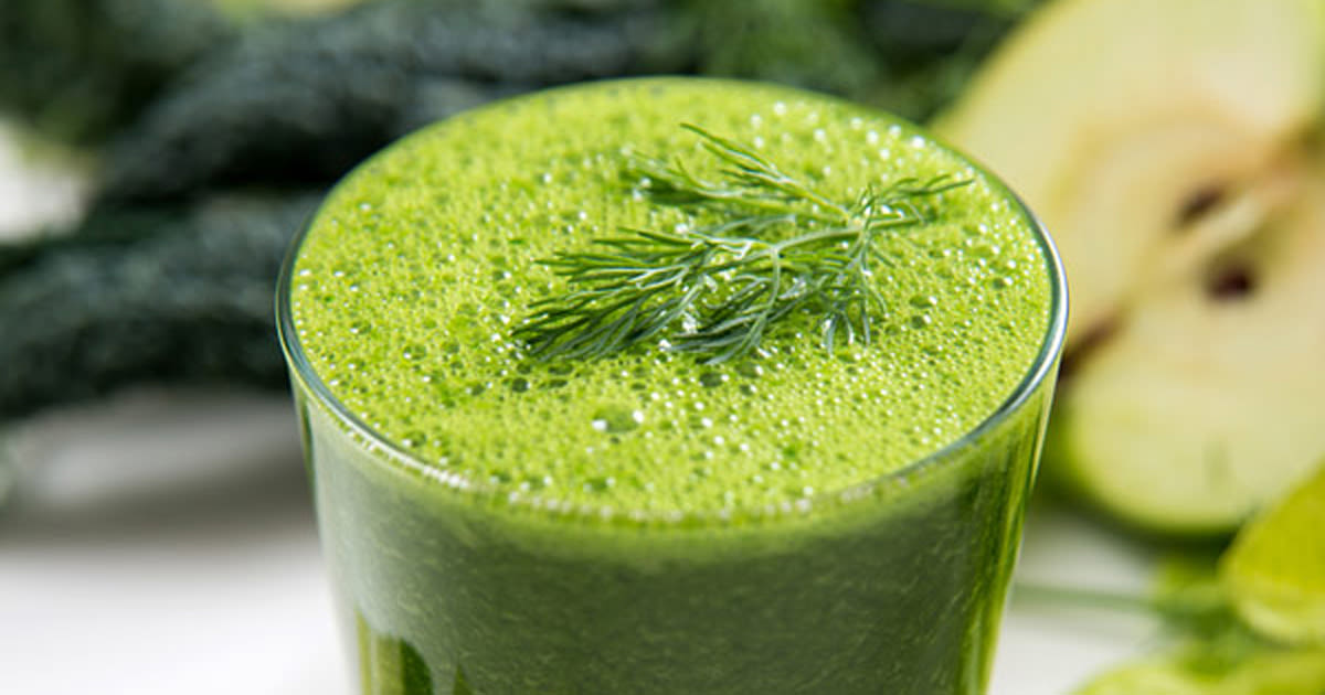 glass full of green smoothie