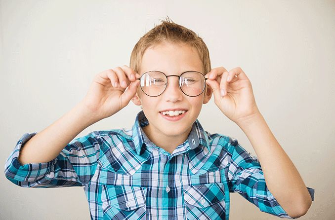 boy wearing glasses with blurry vision