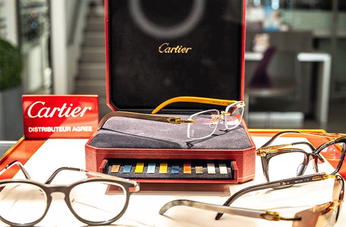 pairs of Cartier glasses on store display