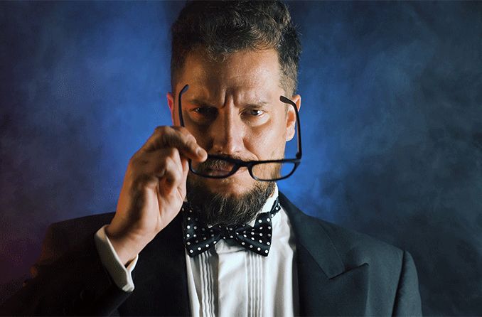 man in suit putting on his spy glasses