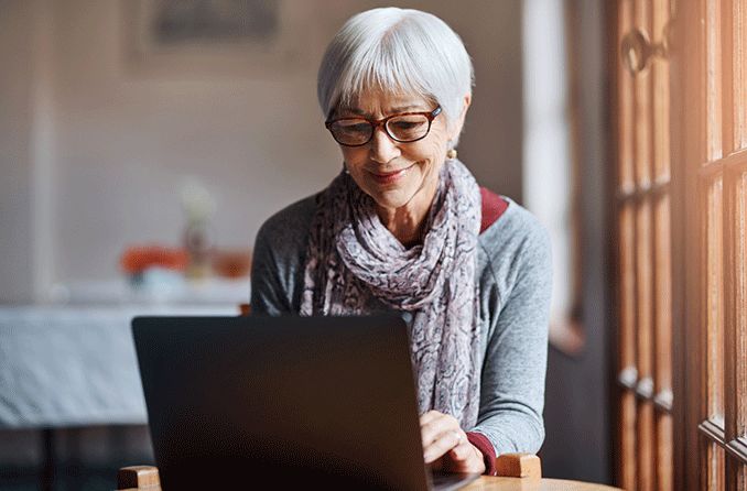 older woman with low vision on laptop computer