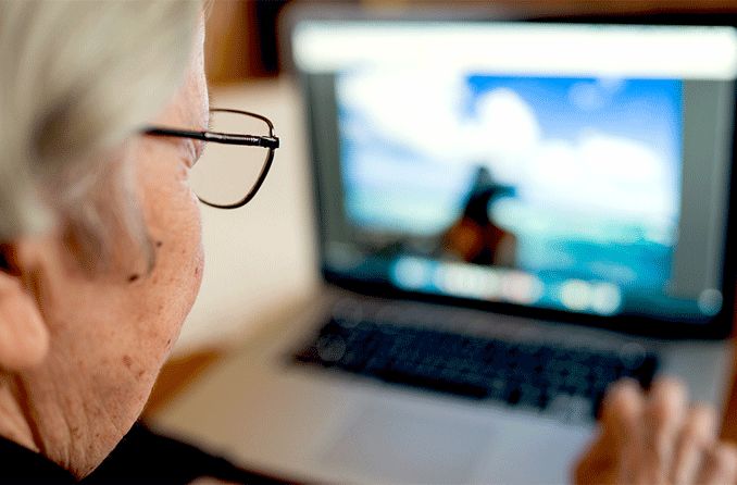 older woman using laptop