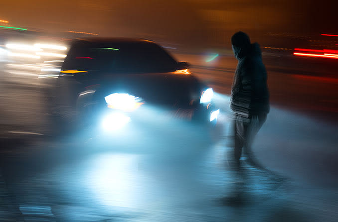 depiction of blurry dangerous driving at night