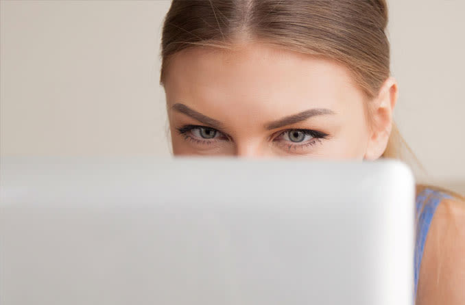 woman looking at laptop taking computer vision quiz