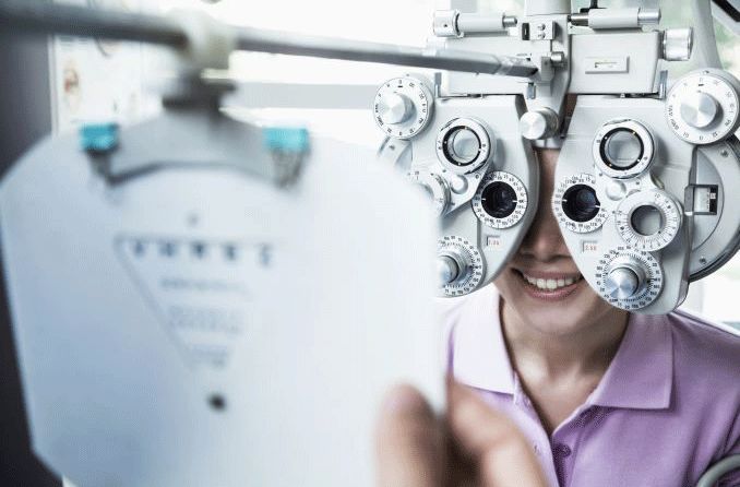 Woman getting eye exam