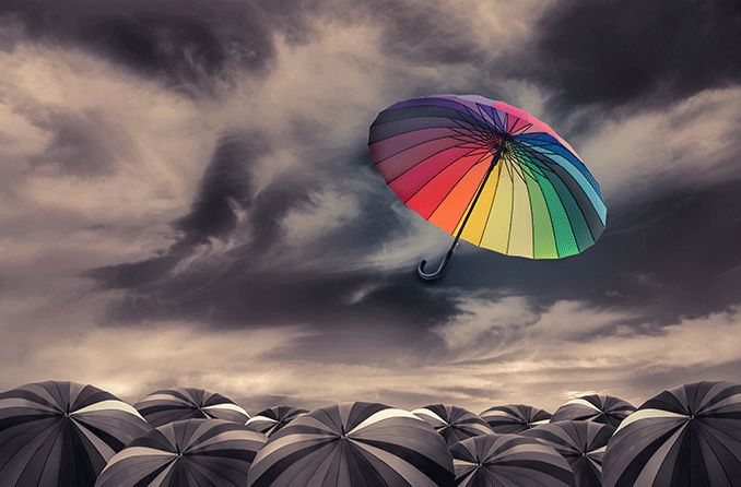 Farbsehen, das einen Regenbogenschirm vor einem grauen Hintergrund zeigt