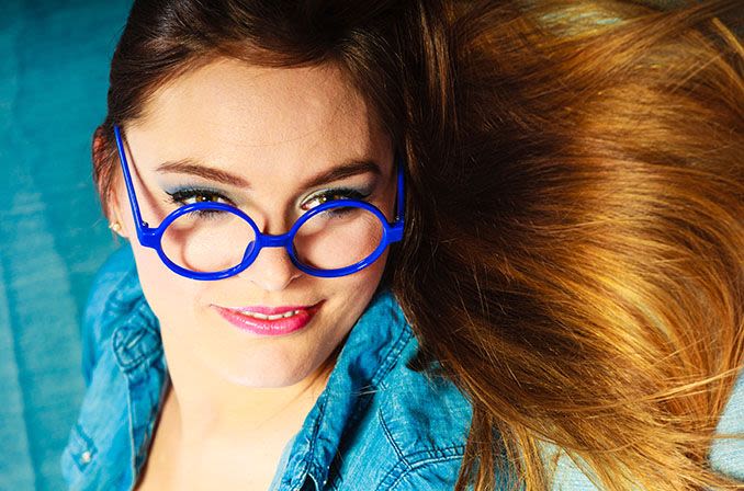 woman with blue round eyeglasses