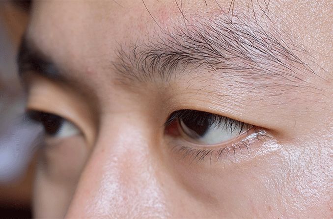 closeup of an Asian man with monolids