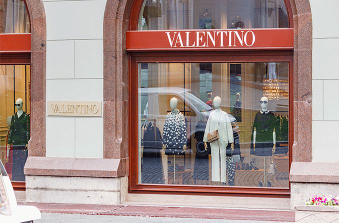 Valentino retail window display with mannequin wearing sunglasses