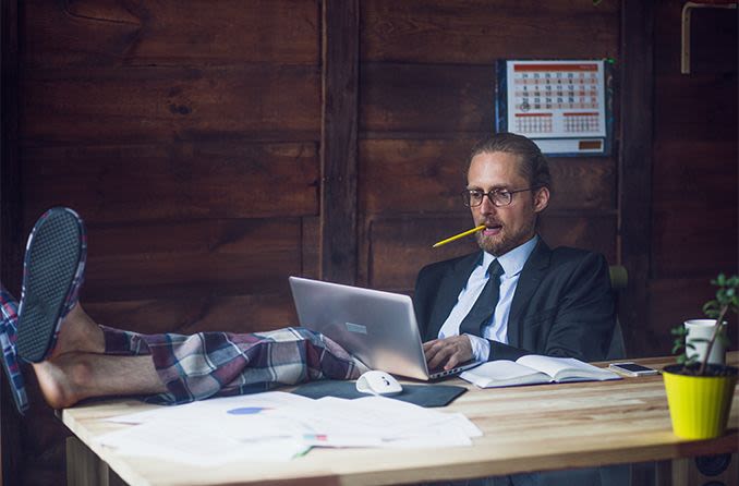man working from home wearing pajama pants and business suit jacket