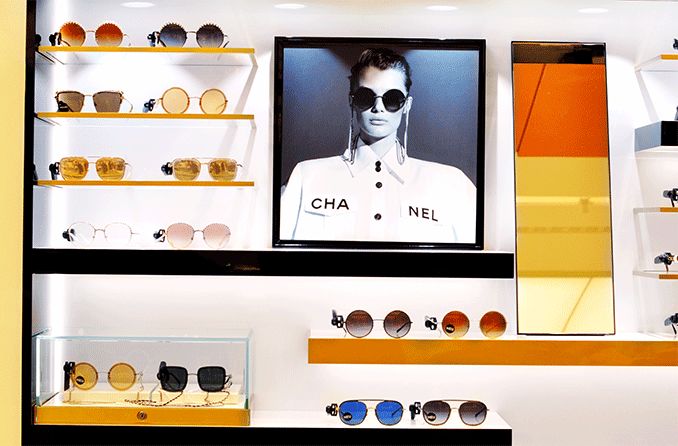 Chanel sunglasses displayed in a retail store window