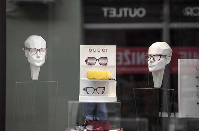 pairs of Gucci glasses on display in a store window