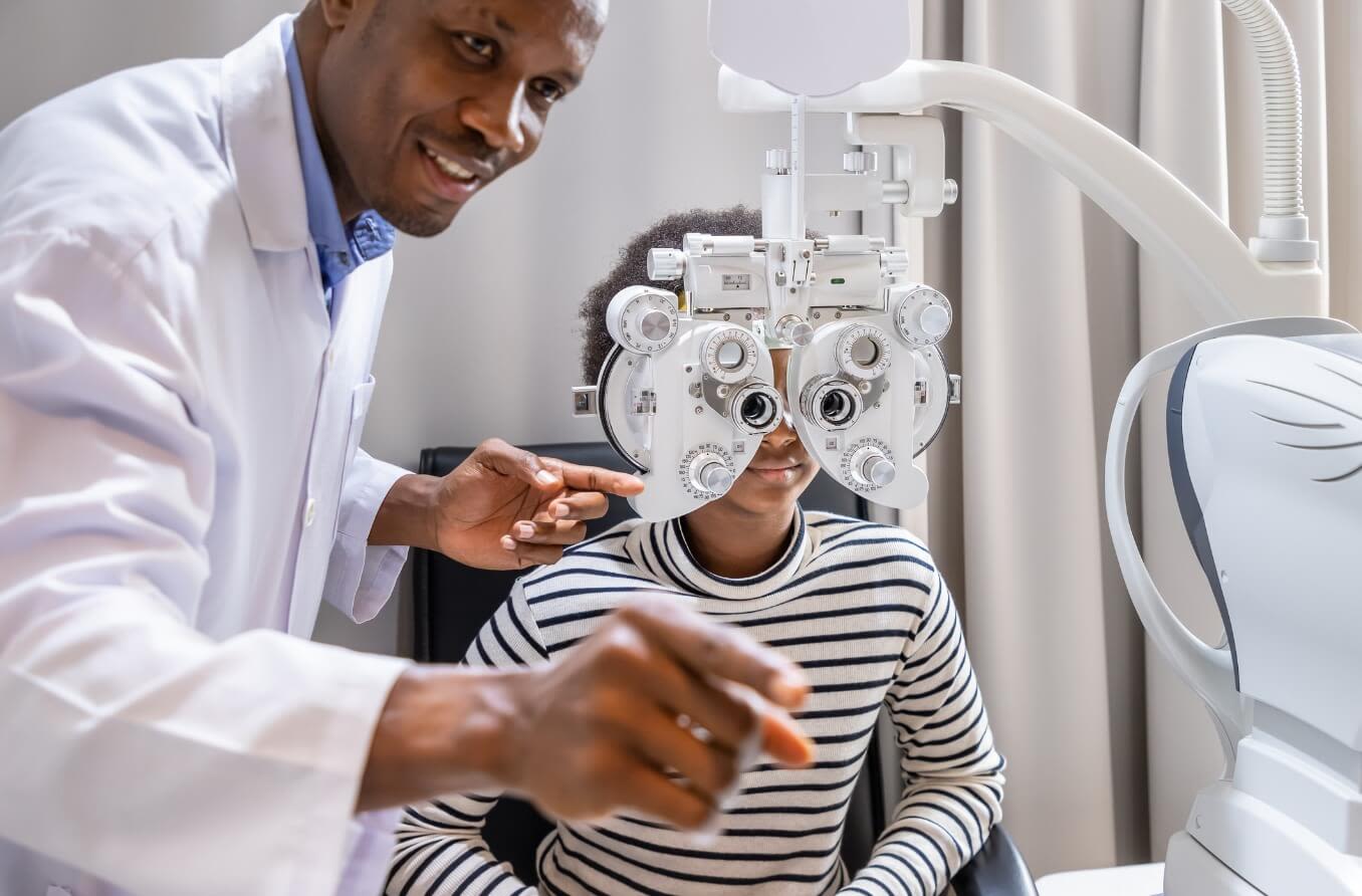 Depiction of an eye doctor providing a child with an eye exam