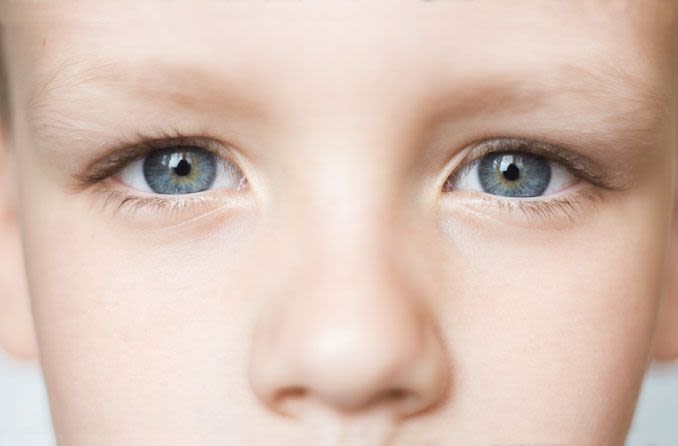 Close up of boys blue eyes