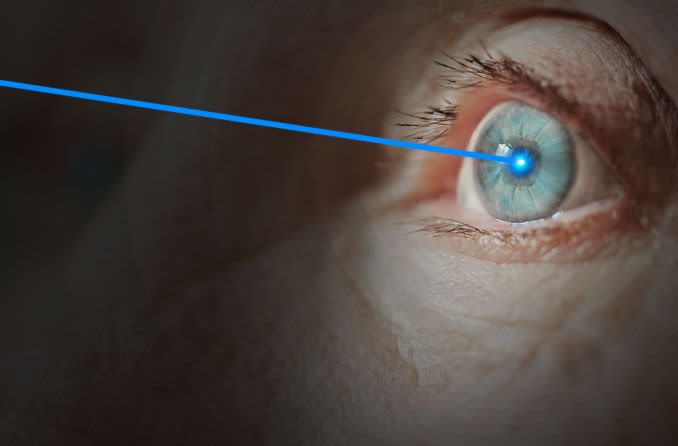 Elderly woman receiving laser eye surgery for cataracts