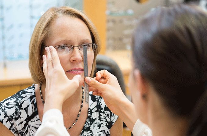 Woman getting fitted for eyeglasses