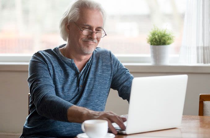 Man shopping online for eyeglasses