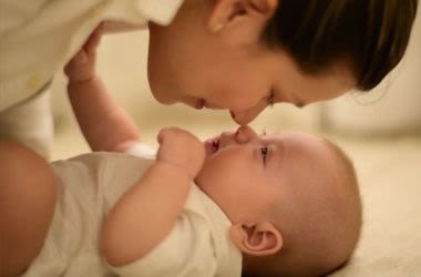 Mother and baby affectionately touching noses
