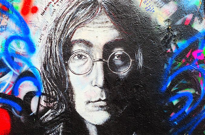 street art portrait of john lennon wearing round glasses