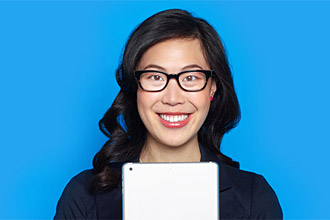 Woman smiling about Eyezen+ blue light lenses