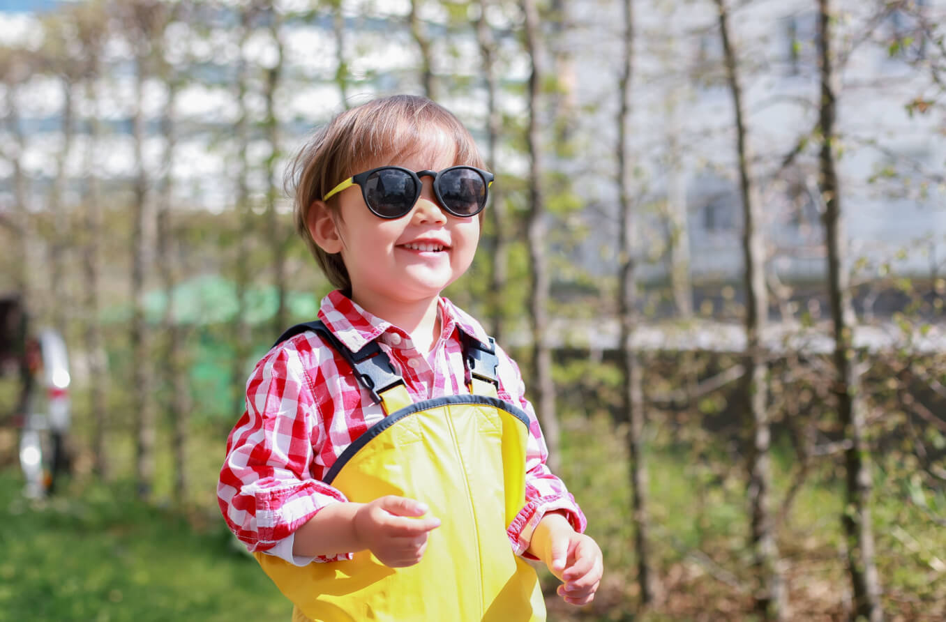 Smiling child wearing sunglasses