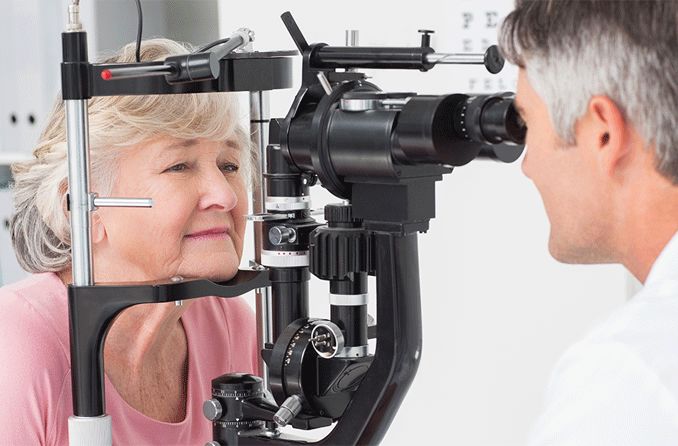 older woman receiving an eye exam