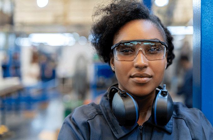 woman wearing safety glasses at work