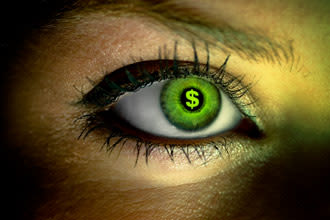 closeup of a green eye with a dollar sign on the pupil