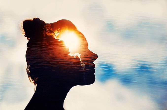 visual perception of young woman on sky background with sun in her head