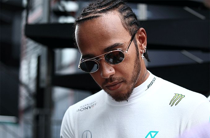 racecar driver, Lewis Hamilton wearing sunglasses