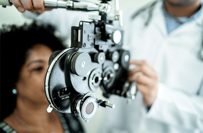woman getting an eye exam testing her visual acuity