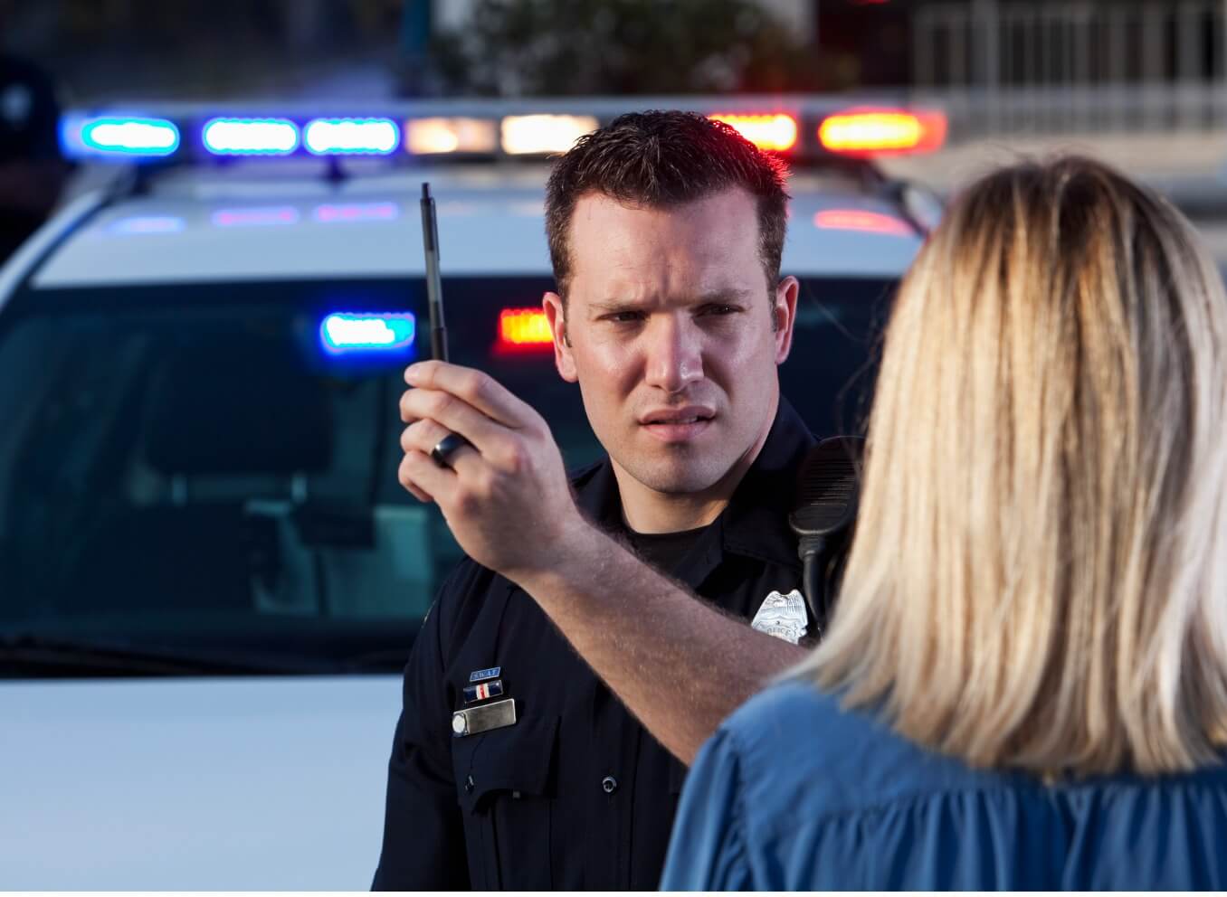 Police officer conducting a field sobriety test