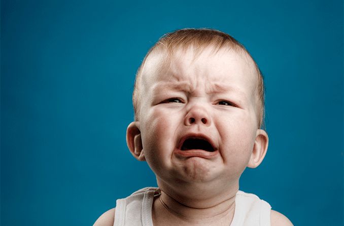 baby with a blocked tear duct crying