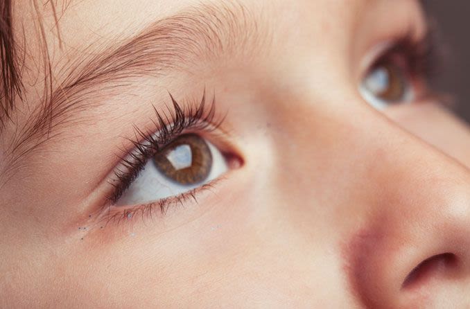 Close-up of boy's eyes.