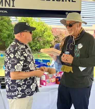 Looking down a table filled with dishes of food during an event