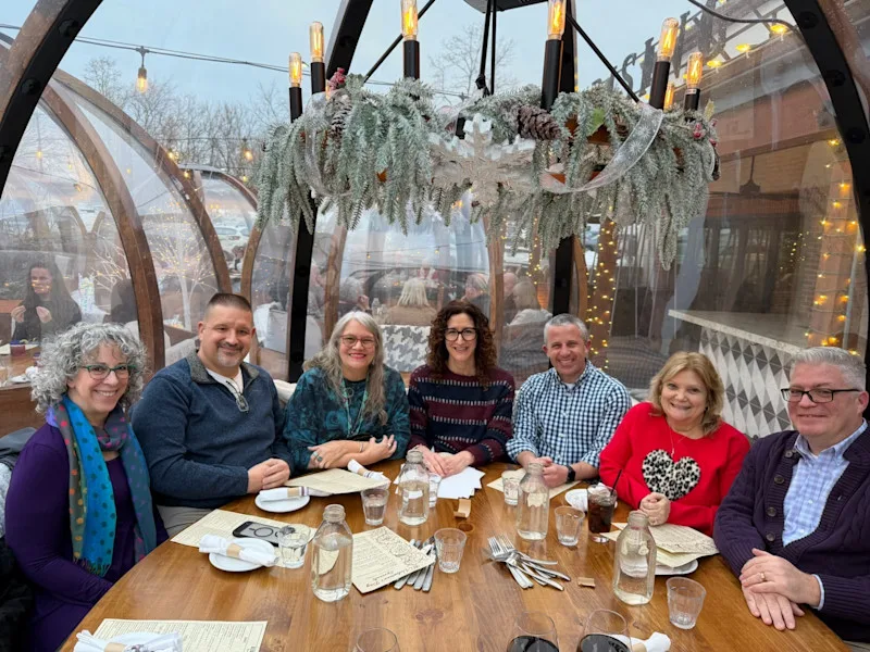 7 members of the Office for Professional Mental Health site at a round table