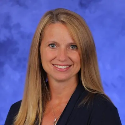 A professional portrait of Marie Kurtz