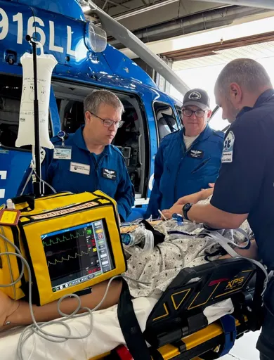 EMS fellows receive training outside a Life Lion helicopter