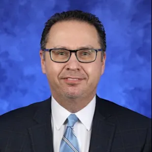 A professional portrait of Brian Spector
