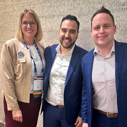 A group photo of facial plastic faculty and resident alumni at medical conference.
