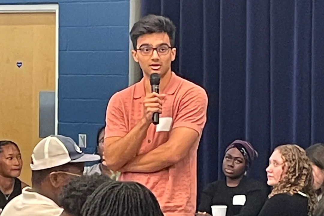 A program participant giving an elevator pitch about his cancer research at the annual MATES event