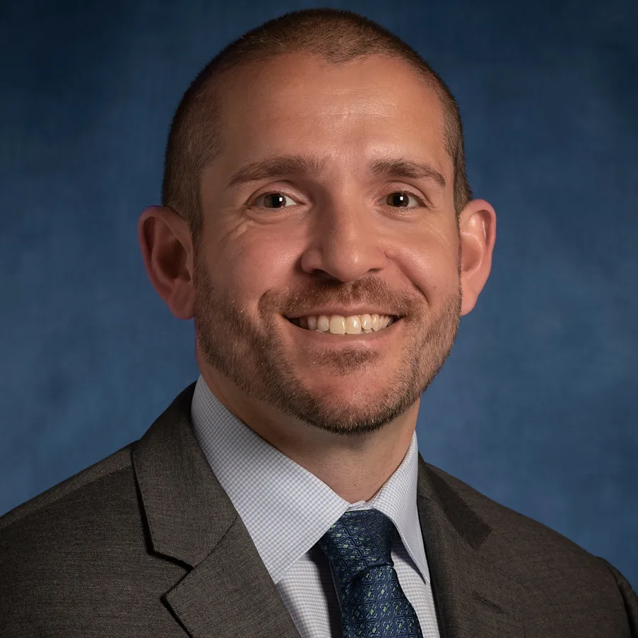 A professional photo of James Beal