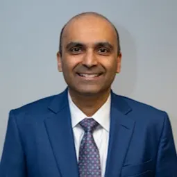A professional portrait of Gautam Mishra