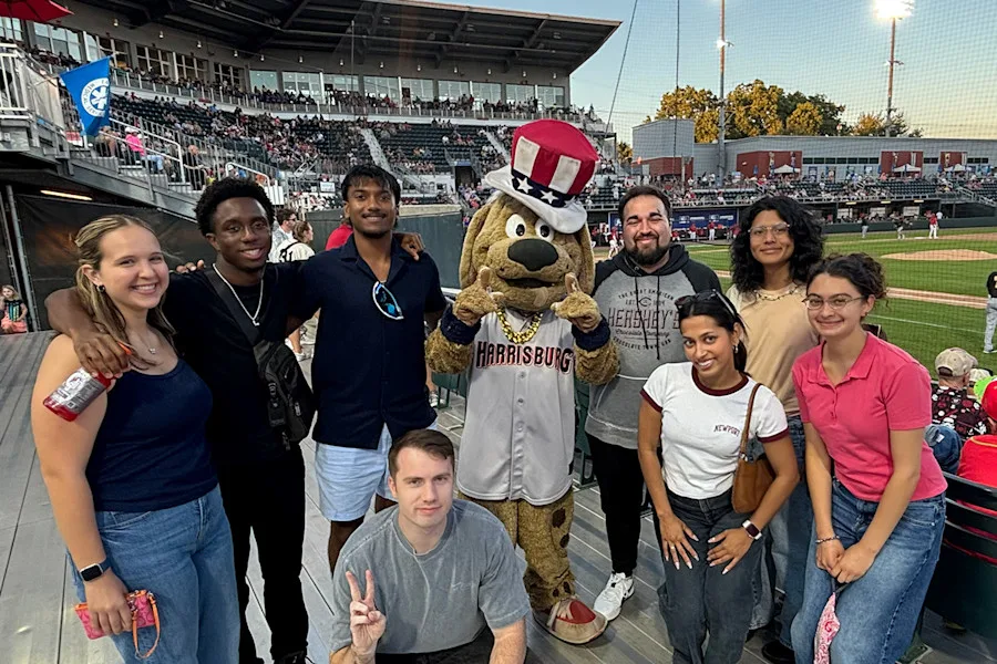 Program participants gathered at a local baseball game with the team mascot
