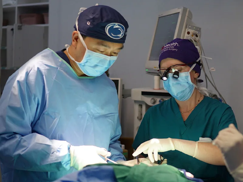 Photo of two surgeons operating