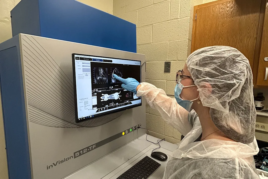 A program participant working in the lab with a high-resolution imaging system