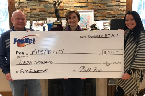 Holding Giant KidsAbility cheque