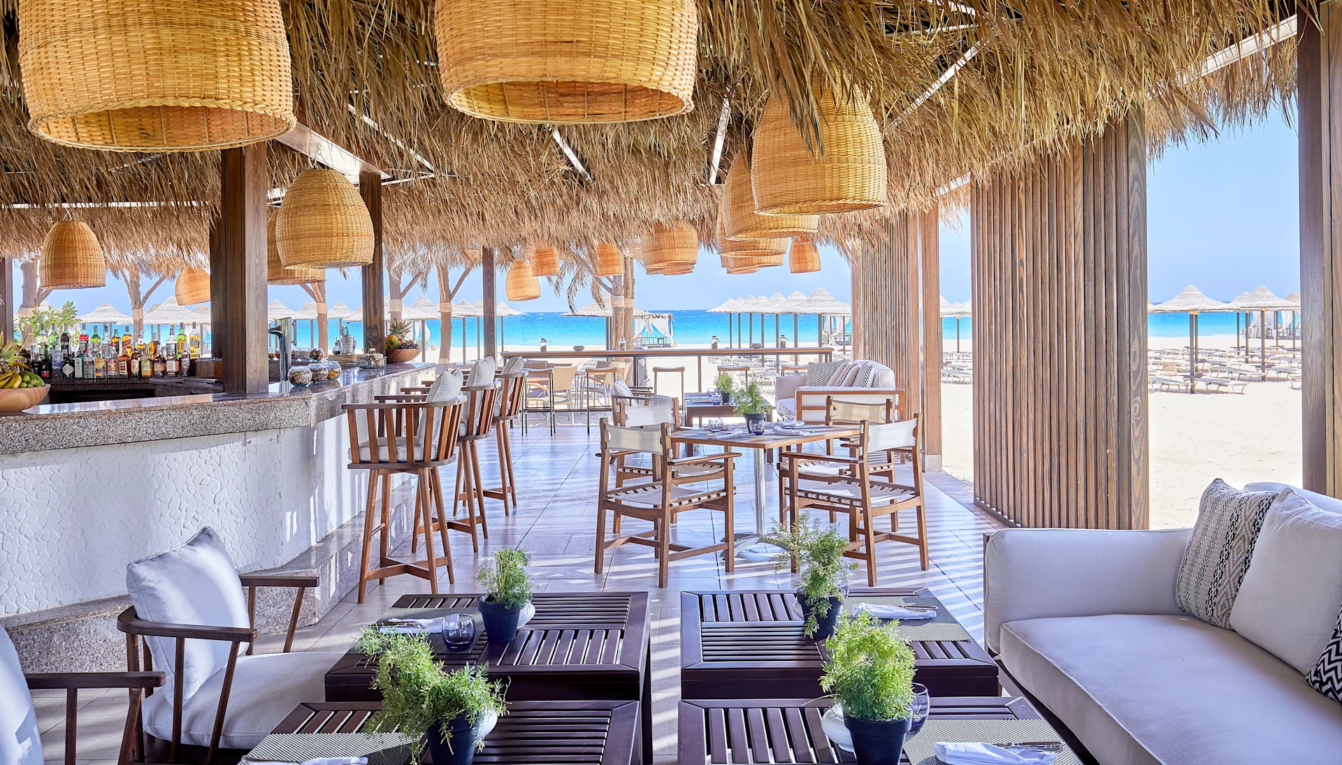 beach bar with view of ocean and beach at Jaz Elite Crystal