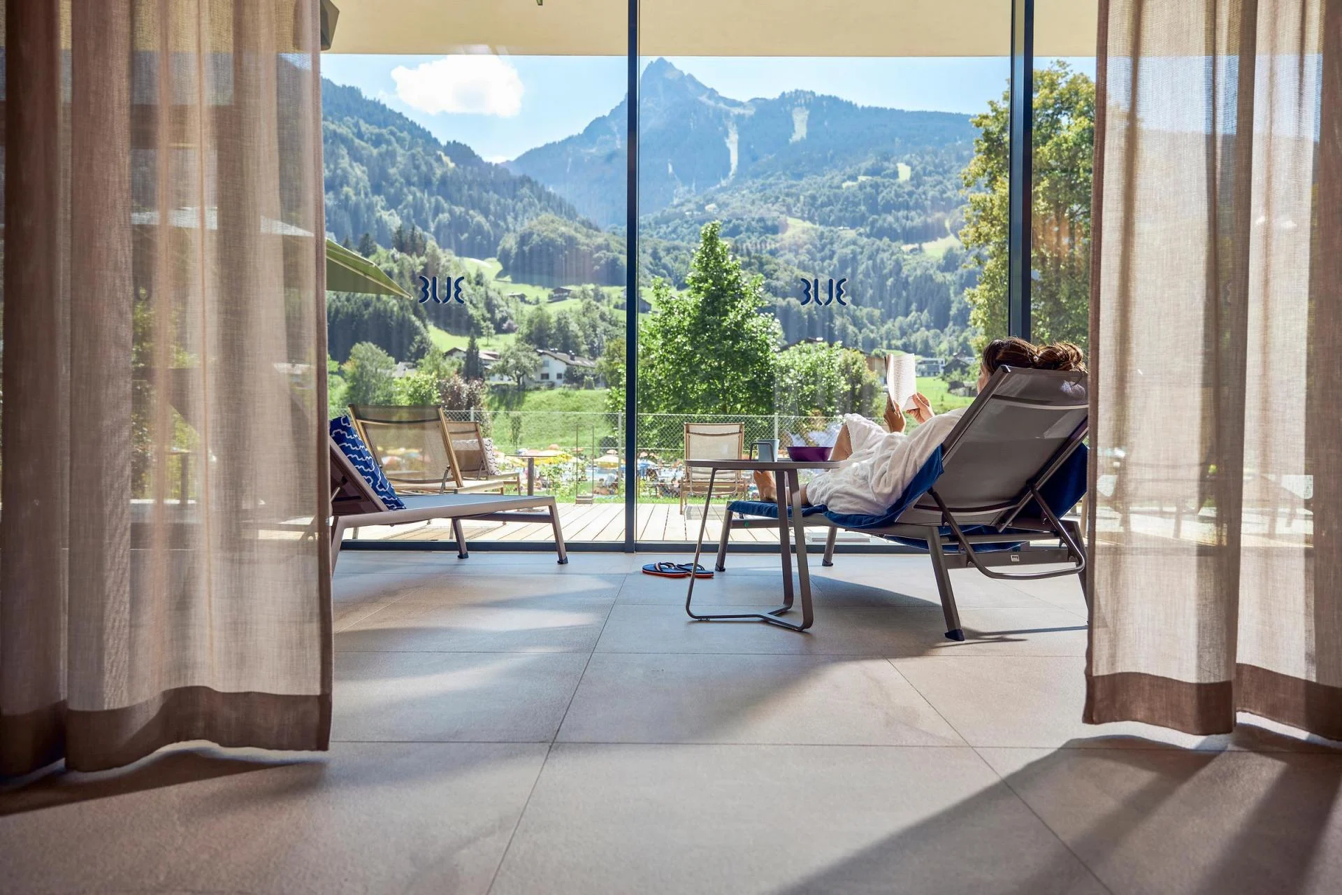 Woman on chair in Spa with mountain view