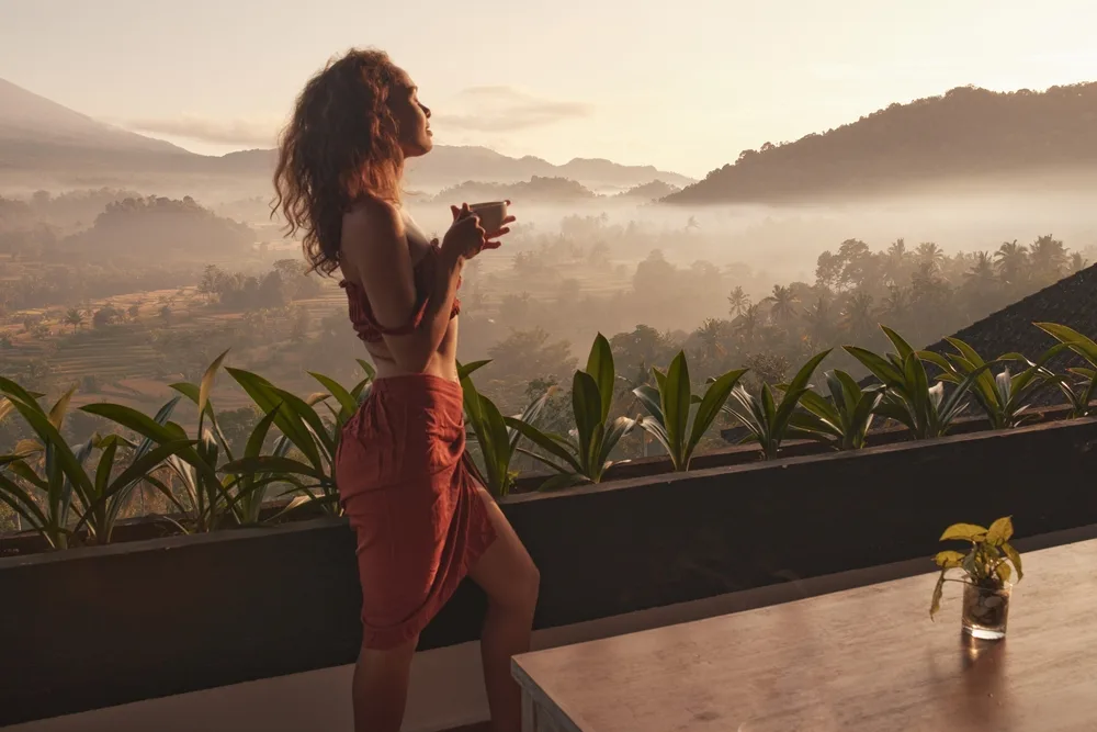 woman-enjoys-peaceful-sunrise-retreat-cup
